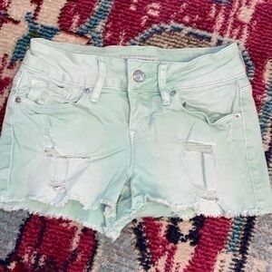 UEC Guess mint green low rise distressed jean shorts size 24